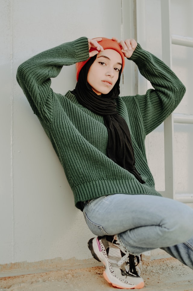 woman wearing sweater and jogging bottoms
